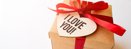 Handmade gift box with sign I LOVE YOU on wooden heartの写真素材
