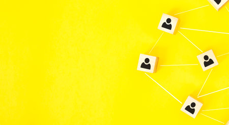 Organization structure, team building, recruitment, business management and human resources concepts. Person icons on wooden cubes linked to each other.の写真素材