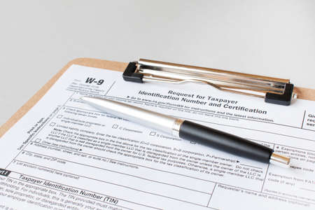 W-9 tax form as a business concept with requesting for TINの写真素材