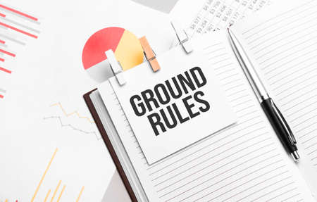 text GROUND RULES on stickers on the diary with office toolsの写真素材