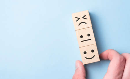 Customer service evaluation and satisfaction survey concepts. The client's hand picked the happy...