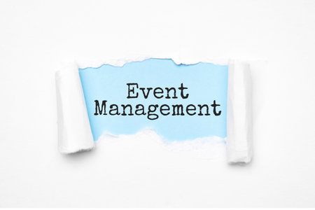 Concept of discovering Event Management tricks. Uncovered unrolled beige torn paper and search engine optimization abbreviation.の写真素材