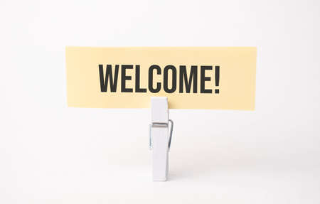 WELCOME text on paper. On white backgroundの写真素材