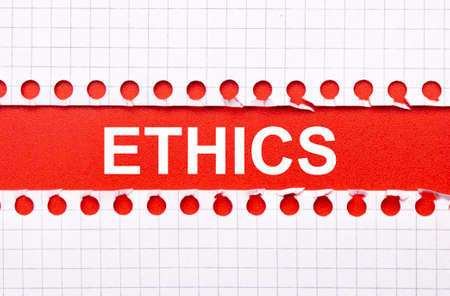 Business and law concept. Between two sheets of notebook on a red background the inscription -...