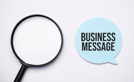 BUSINESS MEETING speech bubble and black magnifier isolated on the yellow background.