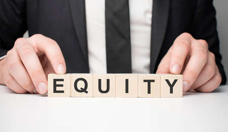 Man made word Equity with wooden blocks. Business concept.の写真素材