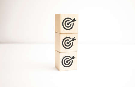 Objective and target concept. Arrow upward to target on wooden cubes.の写真素材