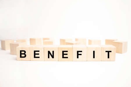benefits word written on wood block. concept businessの写真素材
