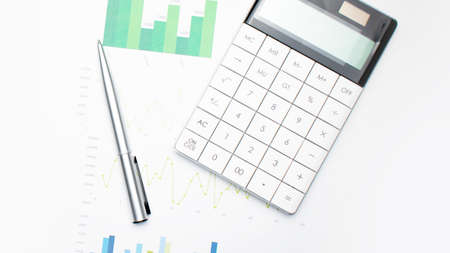 Calculator with pen on financial data. Business and financial research concept.の写真素材