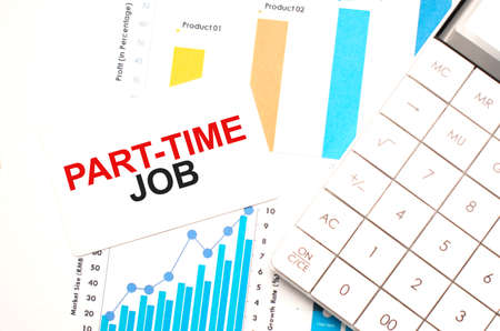 financing availabe text concept. Office workplace table with calculator, graphs, reports and the text Part-time job on a small piece of paper on multicolored background.の写真素材
