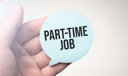 Businessman holding speech buble paper with a message Part-time jobの写真素材