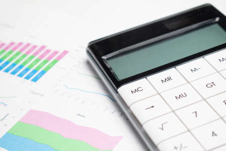 Business Charts Green with calculator, glasses and penの写真素材
