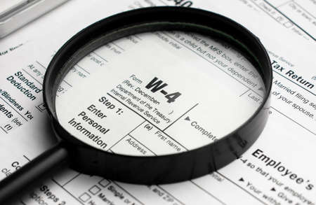 Word TAX 2022 written on wooden cubes. Tax concept