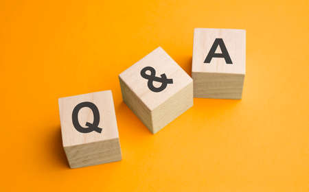 Q and A, questions and answers on wooden cubes. Concept