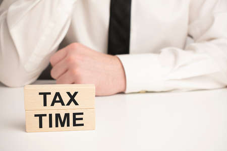 Business meeting time.TAX TIME. Notebook on wood table. Idea presentation, analyze plans.の写真素材