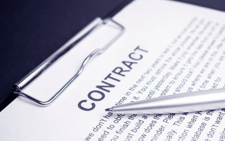 Close-up of silver pen on contract. Selective focus on top of pen.の写真素材