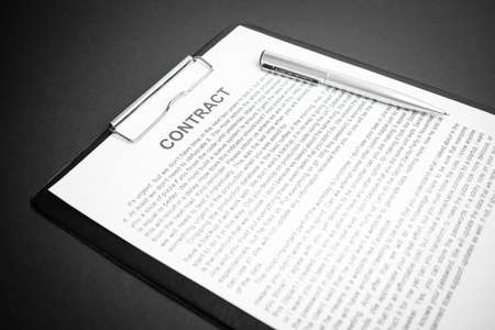 Close-up of silver pen on contract. Selective focus on top of pen.の写真素材