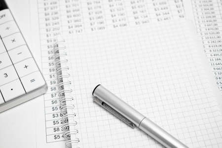 Calculator on white paper with numbers. Business and finance accounting concept.の写真素材