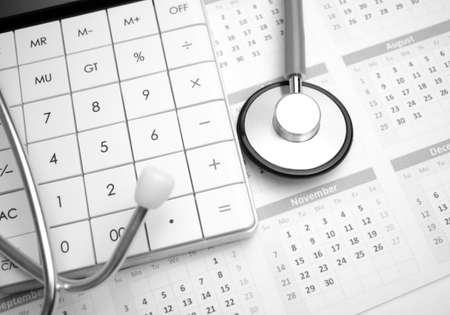 stethoscope and callculator on the calendar. medical conceptの写真素材