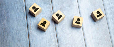 Building a strong team, Wooden blocks with people icon on blue background, Human resources and management concept.の写真素材
