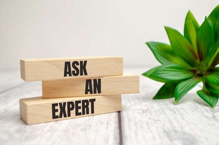 Ask an Expert words on wooden blocks. Consulting a professional, master or consultant for a solution and advice business concept.の写真素材