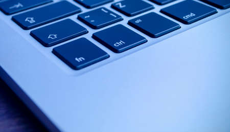 Overhead view of working desk. laptop with blue filterの写真素材