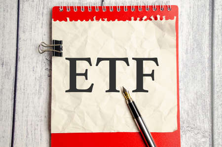 ETF text and pen on sheet of paper on white backgroundの写真素材