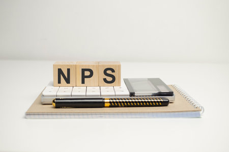 Wooden blocks with words Net Promoter Score . business concept
