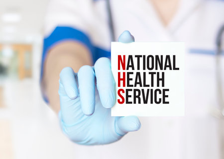 national health service words and doctor's hand with markerの写真素材
