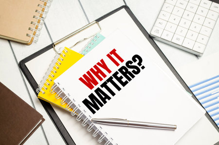 Word writing text Why It Matters Question with notepads and penの写真素材