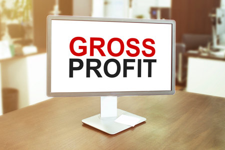Monitor in modern office with text gross profit on the screen in the officeの写真素材