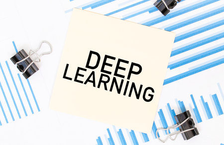 Yellow sticky notes with text DEEP LEARNING on the white office desk. business concept.の写真素材