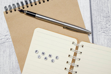 FINACE concept. pen, notebooks and white backgroundの写真素材