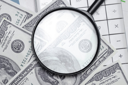 American dollars banknotes under magnifying glass. money backgroundの写真素材