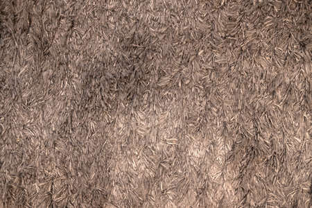 Grey detailed seamless soft textured carpet background. Close up. Place for design.