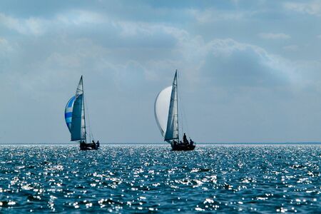 Ship yachts with white sails in the open sea. Sailing. Yachting.の写真素材