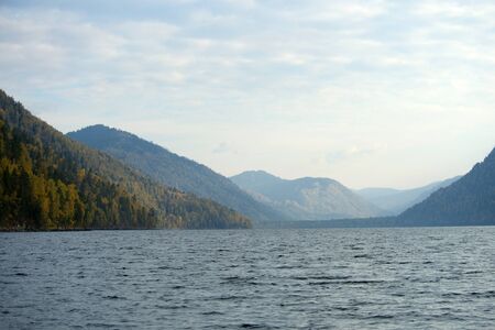 Beautiful mountain lake and distant mountains. Teletskoye in the Altai mountain lakeの写真素材