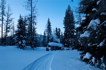 winter hunting lodge in the woods, Altay