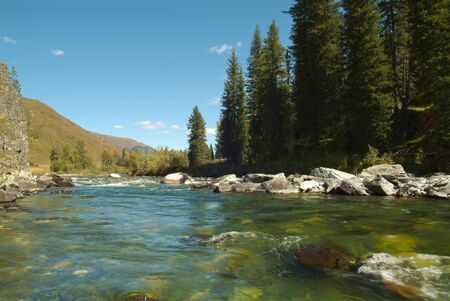 Mountain river with the thresholds