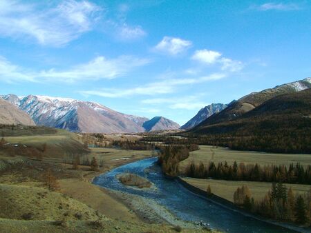 Nice view of the mountains from the Turquoise Katun with blue skyの写真素材