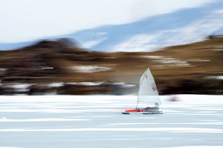 Boat for kitewing frozen ice on a beautiful lake on a background of blue sky, Baikalの写真素材