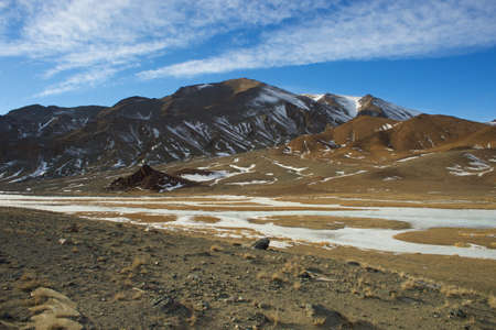 Mongolia view of mountains covered with frozen river in the winterの写真素材