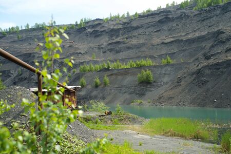 Abandoned and flooded quarry for coal mining in the Kemerovo regionの写真素材