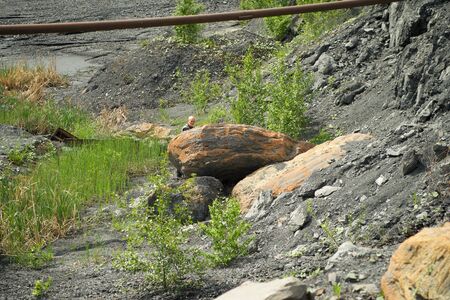 Abandoned and flooded quarry for coal mining in the Kemerovo regionの写真素材