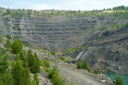 Abandoned and flooded quarry for coal mining in the Kemerovo region