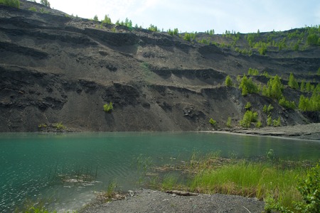 Abandoned and flooded quarry for coal mining in the Kemerovo regionの写真素材