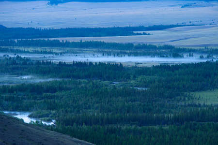 Beautiful sunny valley between the mountains with lush clouds in the Altai Republicの写真素材