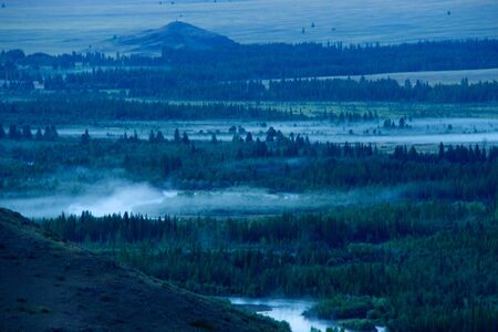 Beautiful sunny valley between the mountains with lush clouds in the Altai Republicの写真素材