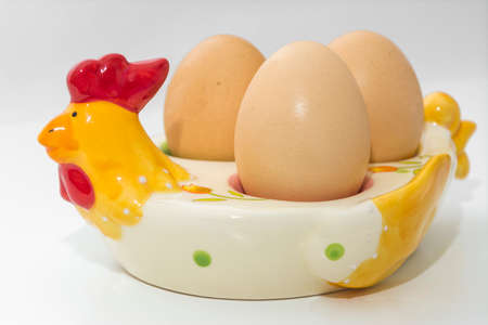 egg on a stand on a white backgroundの写真素材