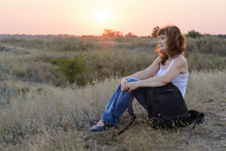 girl with a backpack on topの写真素材
